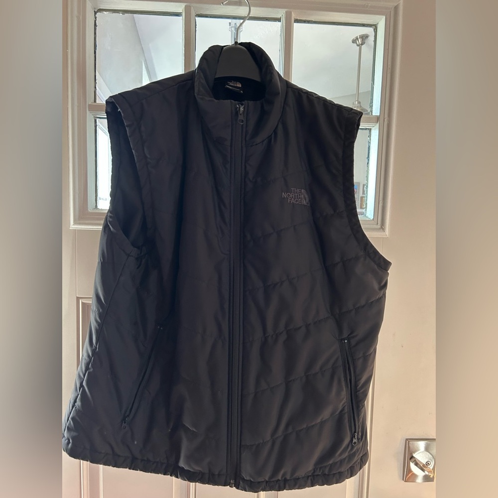 Black North Face vest.
